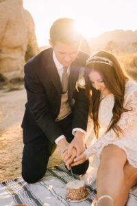 Couple celebrates their elopement with cake cutting in Joshua Tree
